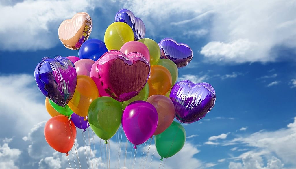 Lots of flying baloons in different colors